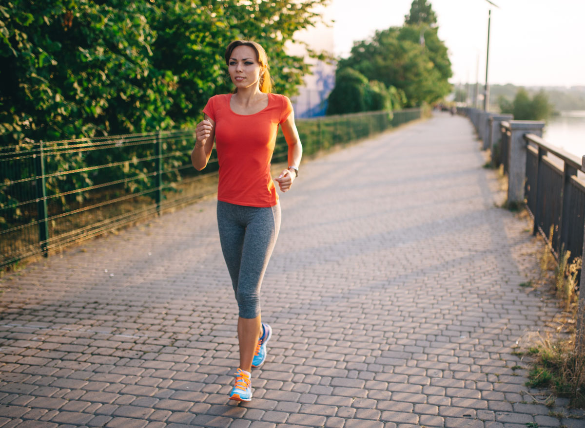 Young fitness woman running outdoor